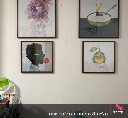 מקדחה חשמלית על שולחן ליד קיר עם תמונות